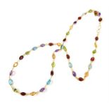 A fine 14 ct yellow gold contemporary multi stone necklace set with faceted amethysts, garnets, blue