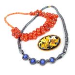 A Carnelian tear-drop pebble necklace, a haematite necklace and an abstract Limoges brooch (3)