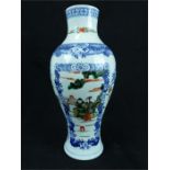 A Chinese famille verte vase; 21 cm high.