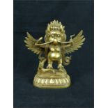 An eastern yellow metal figurine of Garuda; height 22.5 cm.