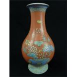 A Chinese, famille rose vase with peach ground; 15.5 cm high.