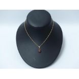 A garnet pendant, 14ct gold mount & chain, 18ct gold clasp.