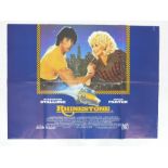 A film poster for "Rhinestone" featuring Sylvester Stallone and Dolly Parton; folded; 76 cm x 101