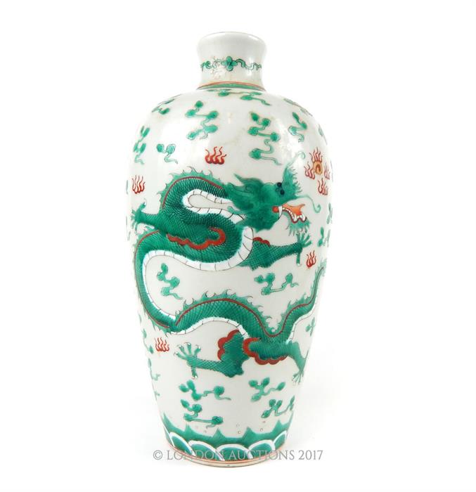 A Chinese porcelain vase, enamelled with a five claw flying dragon among flaming pearls, with an