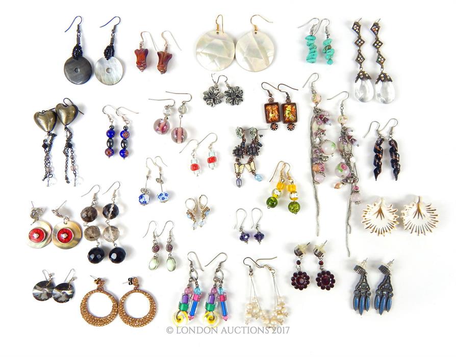 A large, colourful selection of pairs of vintage earrings