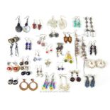 A large, colourful selection of pairs of vintage earrings