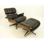 A contemporary black faux leather and plywood armchair with matching stool