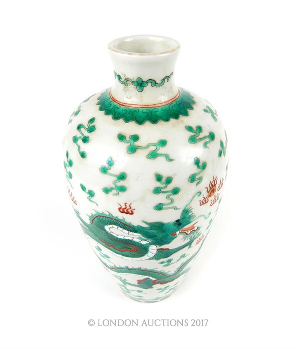 A Chinese porcelain vase, enamelled with a five claw flying dragon among flaming pearls, with an - Image 2 of 3