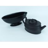 A Neoclassical black basalt teapot of oval form with a Wedgwood black glazed jardiniere