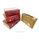 A set of three canvas Airess suitcases each with red leather mounts, embossed with initials J. M.
