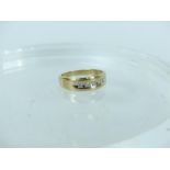 A 14 ct yellow gold ring set with 5 round-cut diamonds