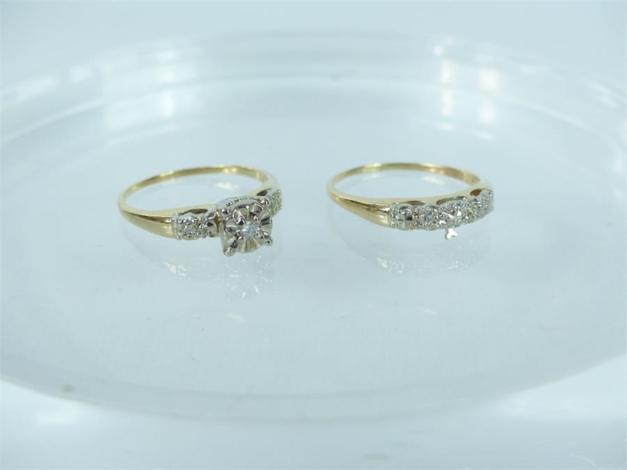 A vintage 1940's 14 ct yellow and white gold brilliant cut diamond wedding ring set.