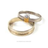 A contemporary, handmade boxed 18 ct white and yellow gold engagement ring with wedding band