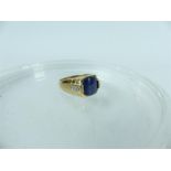 A 9 ct yellow gold gentleman's synthetic star sapphire and diamond ring