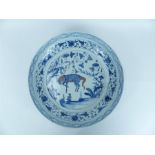 A large 19th century Chinese blue and white charger featuring a goat and floral designs; 45.5 cm