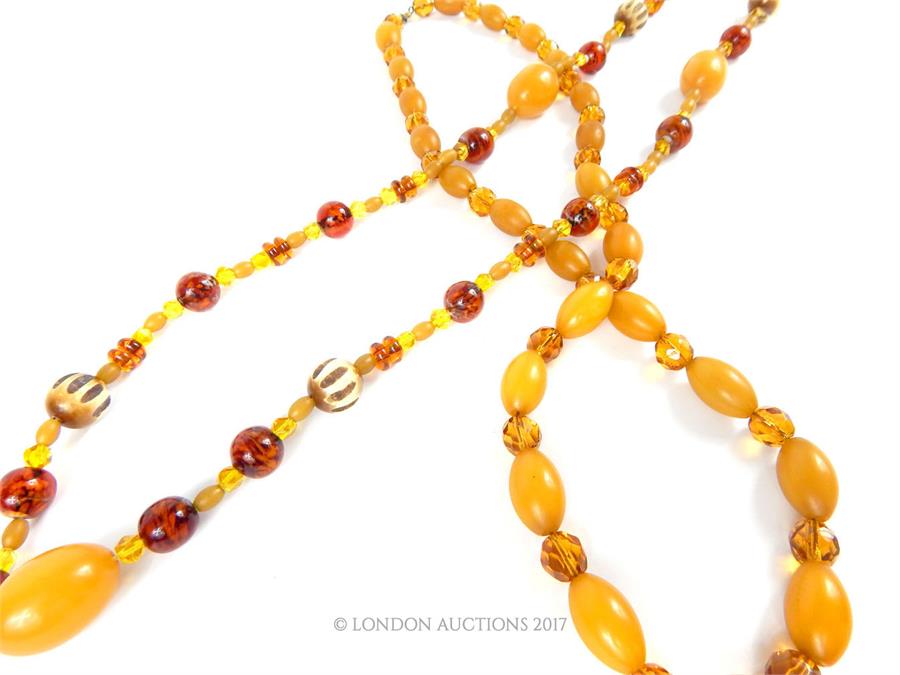 Two 1920s, possibly Baltic amber bead necklaces, each set with faceted glass spacers, one with - Image 2 of 2