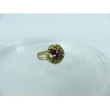 A 9 carat gold amethyst and peridot cluster cocktail ring; 5 g; size R 1/2