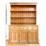 A large 19th / early 20th century stripped pine Welsh dresser, with three shelves above three