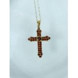 A vintage 9ct yellow gold garnet-set crucifix pendant and chain