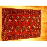 A Persian Shiraz rug with a red ground, 120 x 84cm