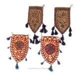 Two pairs of eastern heavy woollen saddlebags, decorated with cowrie shells and tassles. (4)