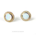 A pair of sterling silver opal stud earrings