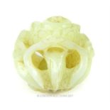 A 19th century Chinese carved jade carved concentric ball in the form of a fire breathing dragon,