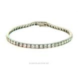 An 18 ct white gold diamond-set articulated, tennis- link bracelet