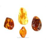 Four large, chunky, amber pendants