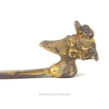 A Liao Dynasty (10 - 12th century) Chinese gilded silver hairpin, cast with a Mandarin duck, 12cm