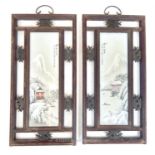 A pair of Chinese, Republic period enamelled porcelain plaques, within a pierced hanging hardwood