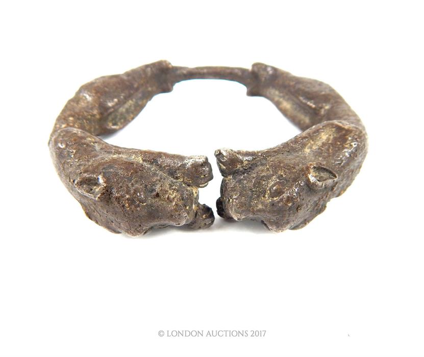 An eastern white metal bracelet decorated with panthers; 9 cm diameter. - Image 2 of 3