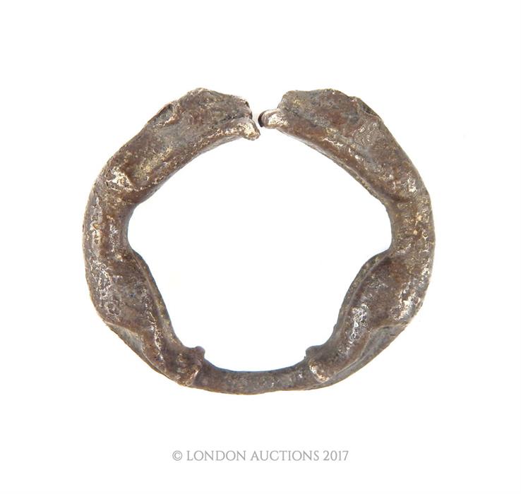 An eastern white metal bracelet decorated with panthers; 9 cm diameter. - Image 3 of 3