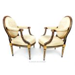 A pair of antique Louis XVI design French fauteils, upholstered in ivory damask