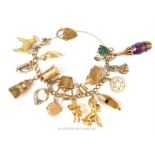 A 9 ct yellow gold charm bracelet