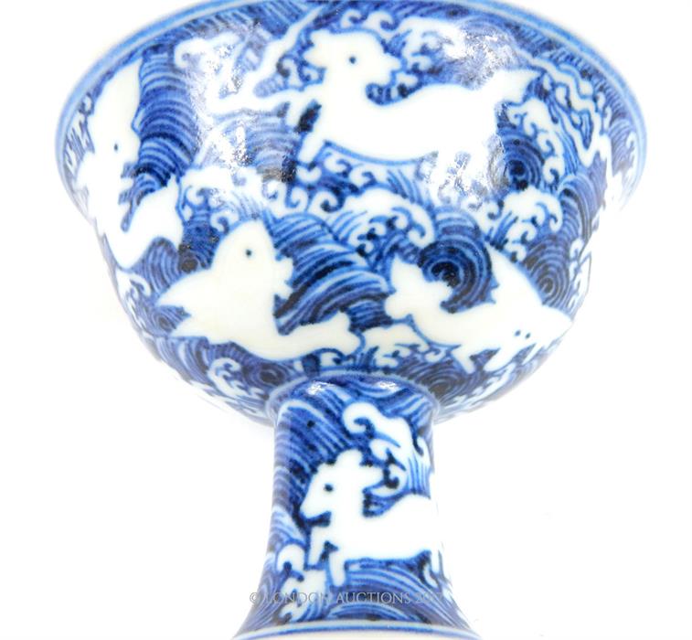 A Chinese Ming style blue and white porcelain stem cup, of typical form, the painted outer - Image 3 of 3