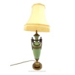 A celadon green ceramic table lamp with classical style cast metal mounts and shade