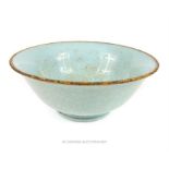 A Chinese pottery Song Dynasty style bowl, with duck egg crackle glaze, the interior well incised