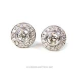 A pair of diamond stud earrings