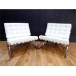 A pair of cream leather button back and seated Barcelona chairs, after a design by Ludwig Mies van