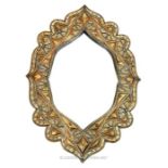 A North African mirror decorated with bone, copper, and embossed white metal