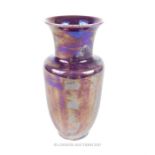 A Ruskin pottery purple lustre glazed vase