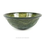 A late 19th / early 20th century Chinese spinach green jade bowl, carved with flaming pearl and four