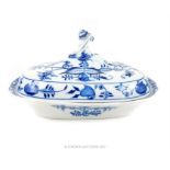 Meissen blue and white lidded tureen, floral and fruit decorated, twisted finial, cross swords