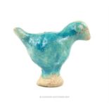 A Kashan turquoise glazed, ceramic bird figurine; 8 cm high.