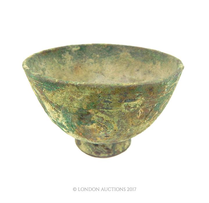 An Islamic bronze bowl with floral engraving amd also featuring a Persian signature to its base; 9.7 - Image 2 of 2