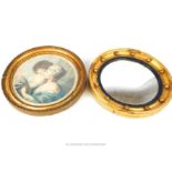 Small circular porthole mirror, gilded frame, 27 cm diameter, together with a circular framed