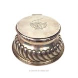 A late Victorian silver inkwell by Goldsmiths and Silversmiths Co. maker's mark J.G S to cover,
