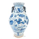 A Chinese Ming style blue and white pottery twin handled vase, with twin moulded handles in the form