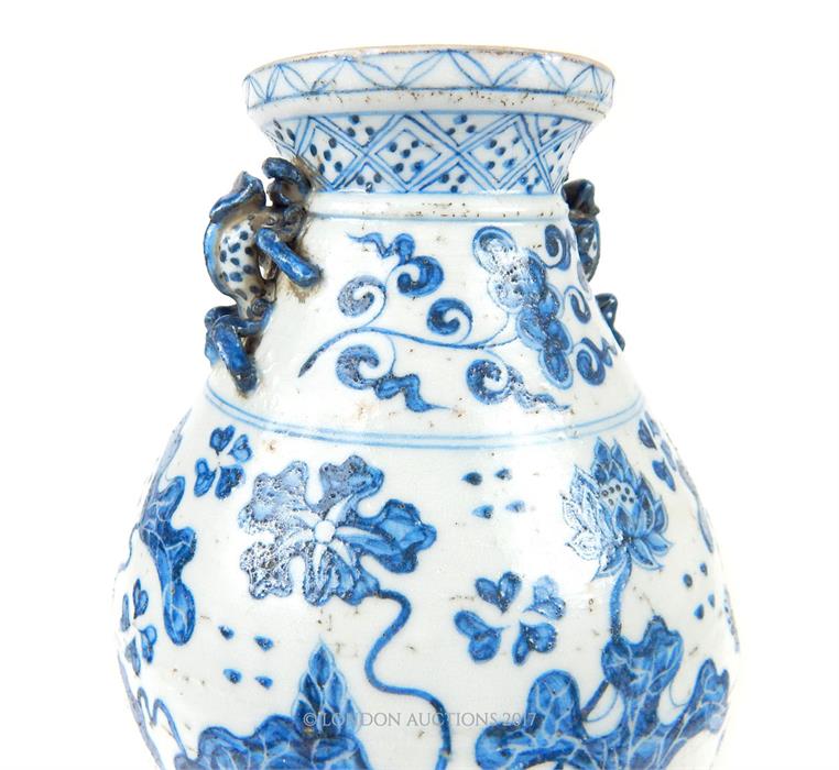 A Chinese Ming style blue and white pottery twin handled vase, with twin moulded handles in the form - Image 2 of 5